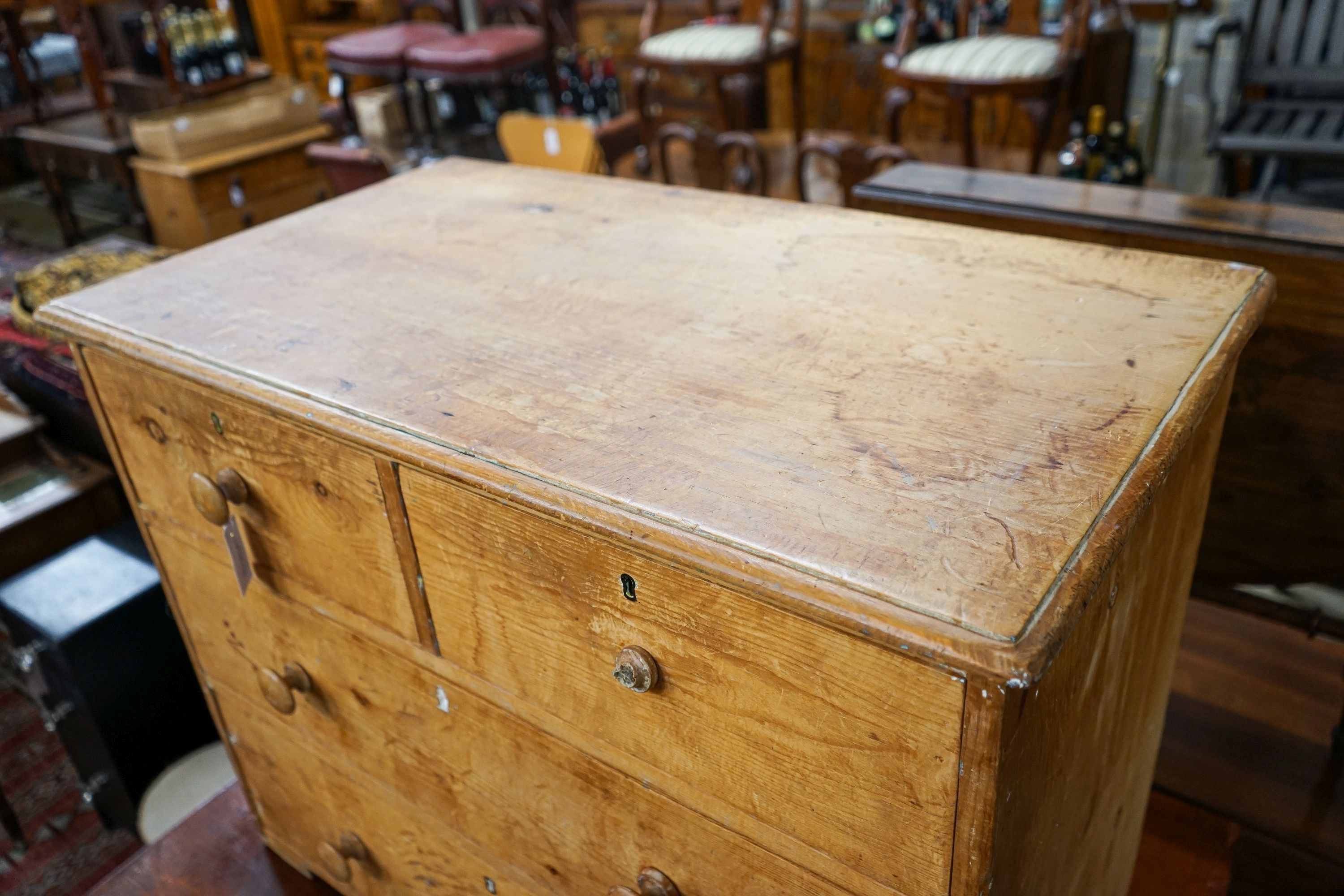 A Victorian stripped pine chest of drawers (lacking feet), width 95cm, depth 53cm, height 74cm
